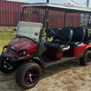 2023 E-Z-GO Express L6 ELiTE Lithium lifted six-seater golf cart in Inferno Red, front three-quarter view