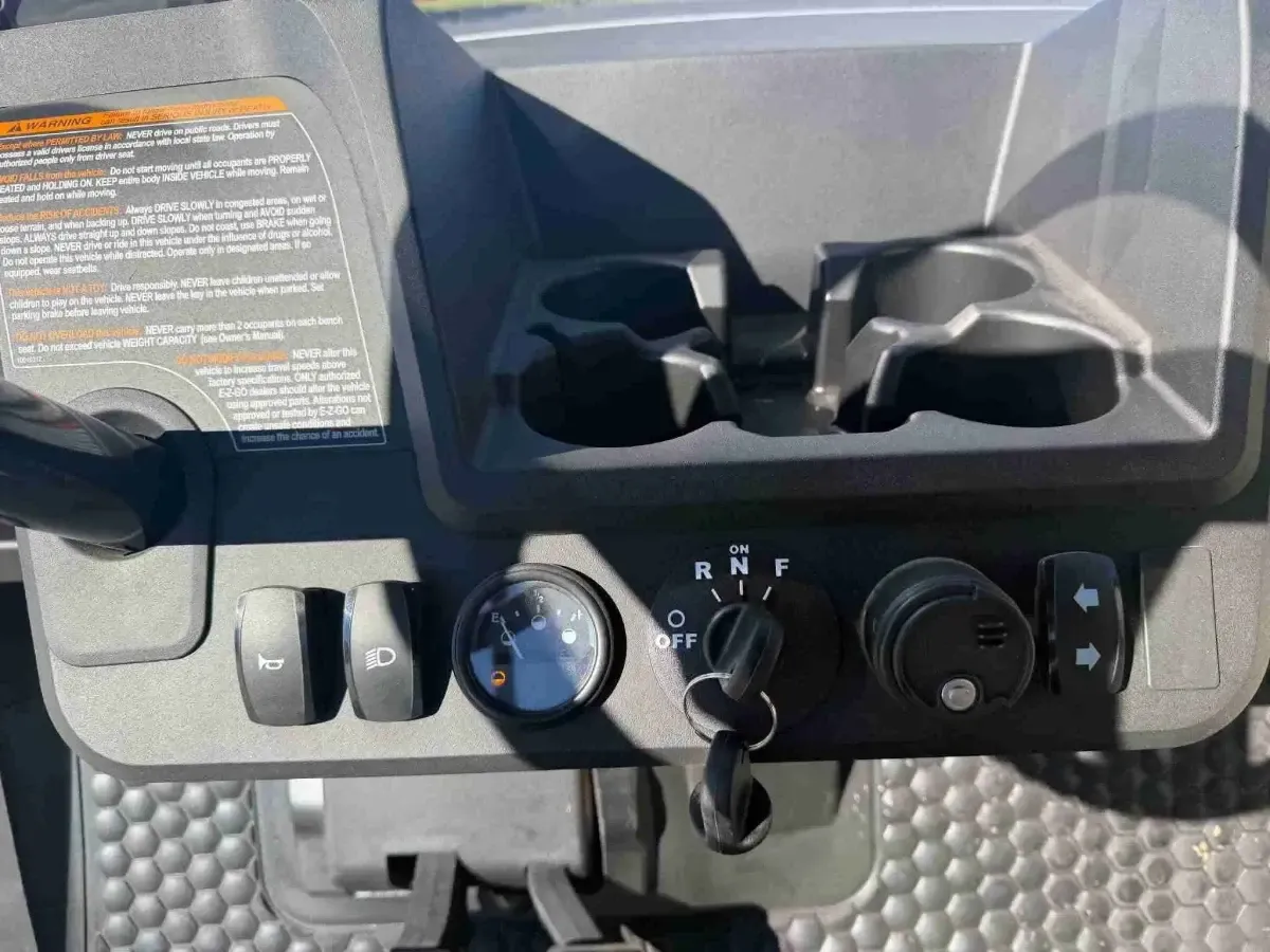 Dash controls with horn, lights, charge meter and turn signal switches on the 2026 E-Z-GO RXV Valor 2 S+