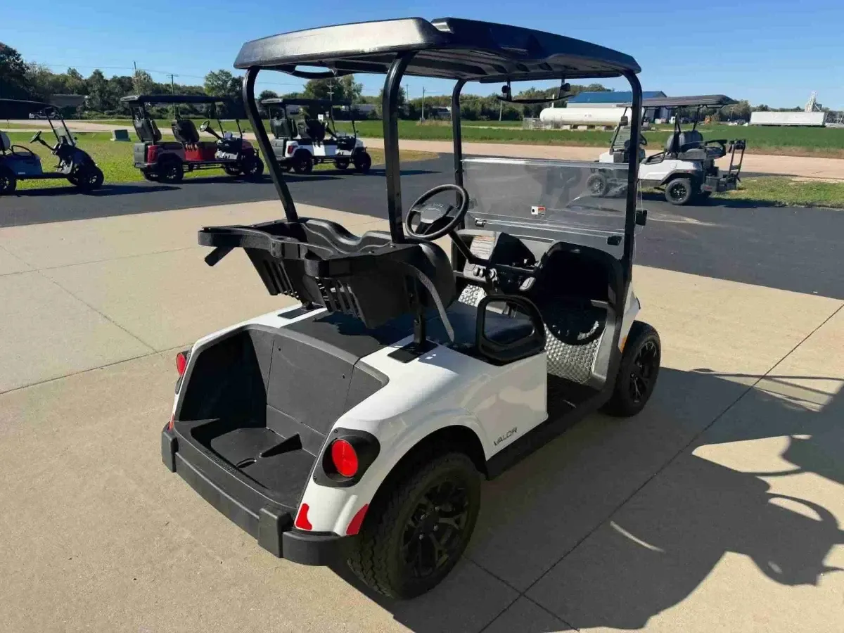 2026 E-Z-GO RXV Valor 2 S+ in White, rear three-quarter view with cargo bed