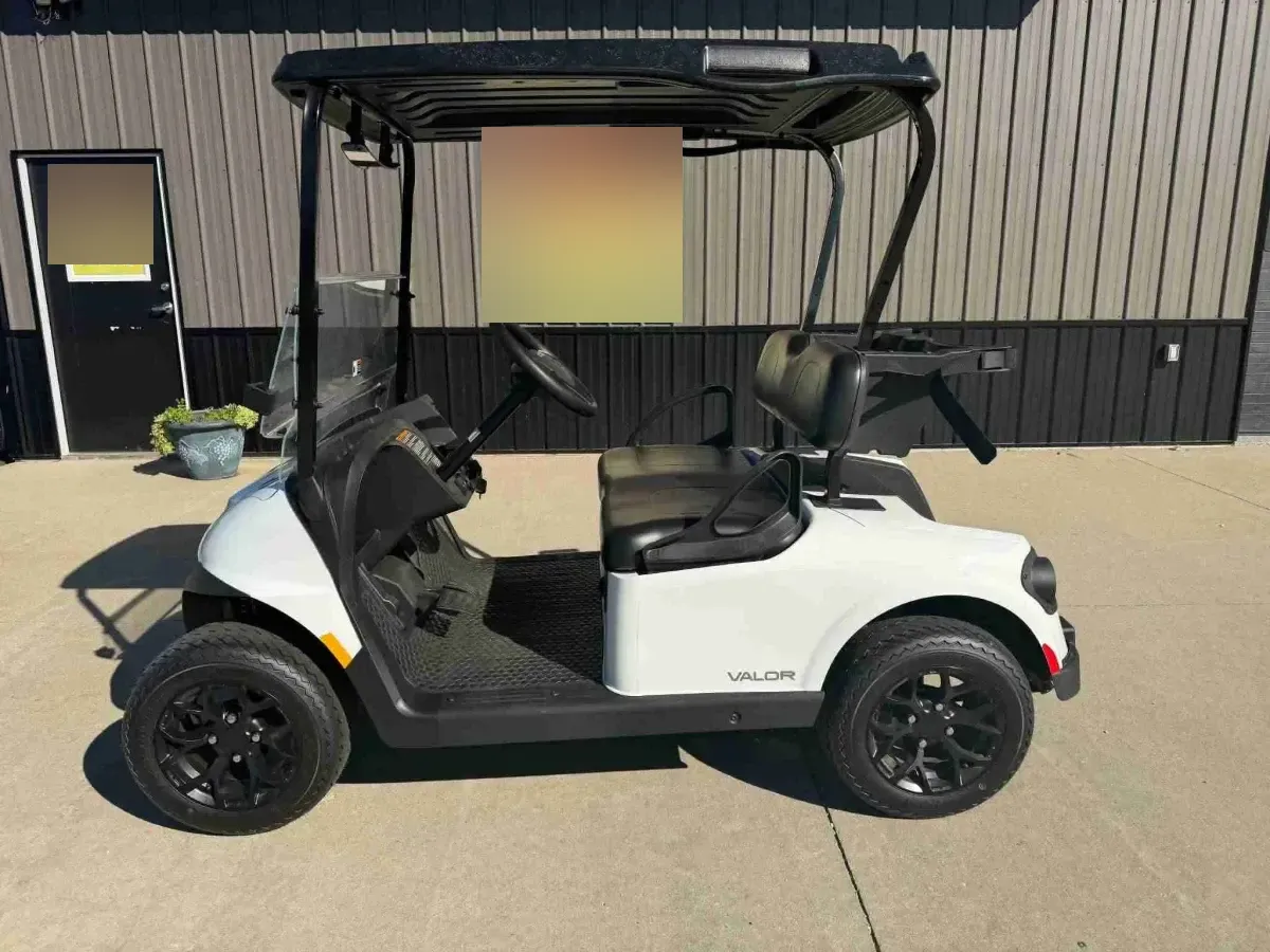 2026 E-Z-GO RXV Valor 2 S+ in White, side profile with black seats