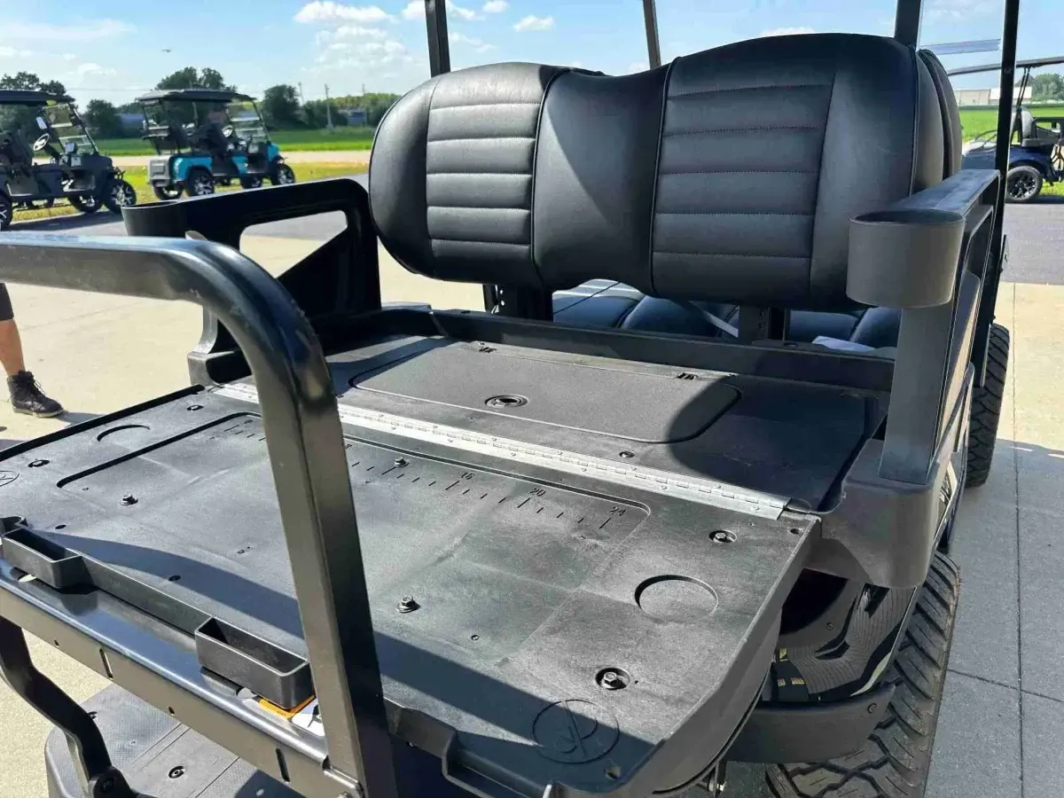 Rear seat folded into a flat cargo deck on the 2027 E-Z-GO Express 4 Summit XT