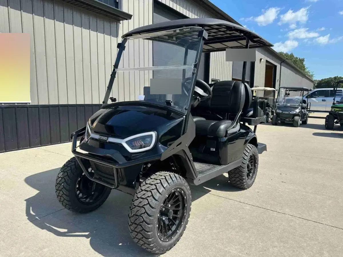 2027 E-Z-GO Express 4 Summit XT in Black, front angle showing LED headlights, brush guard and off-road tyres