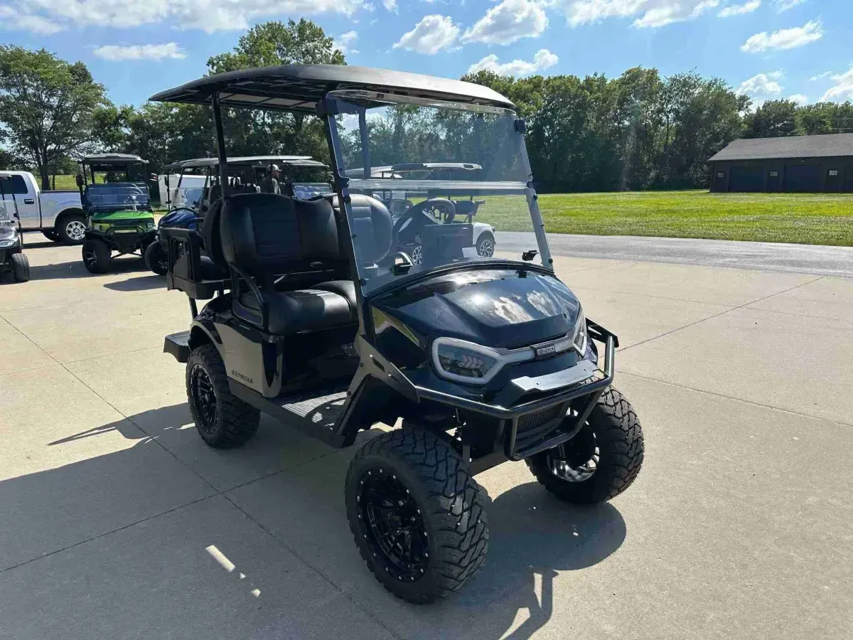 2027 E-Z-GO Express 4 Summit XT in Black, front right view with lifted stance