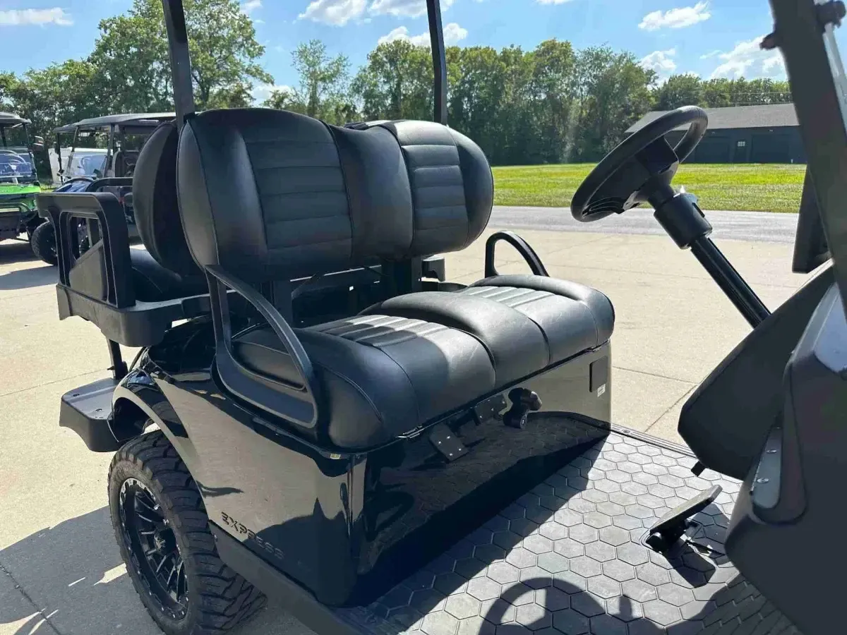 Black front bench seat of the 2027 E-Z-GO Express 4 Summit XT