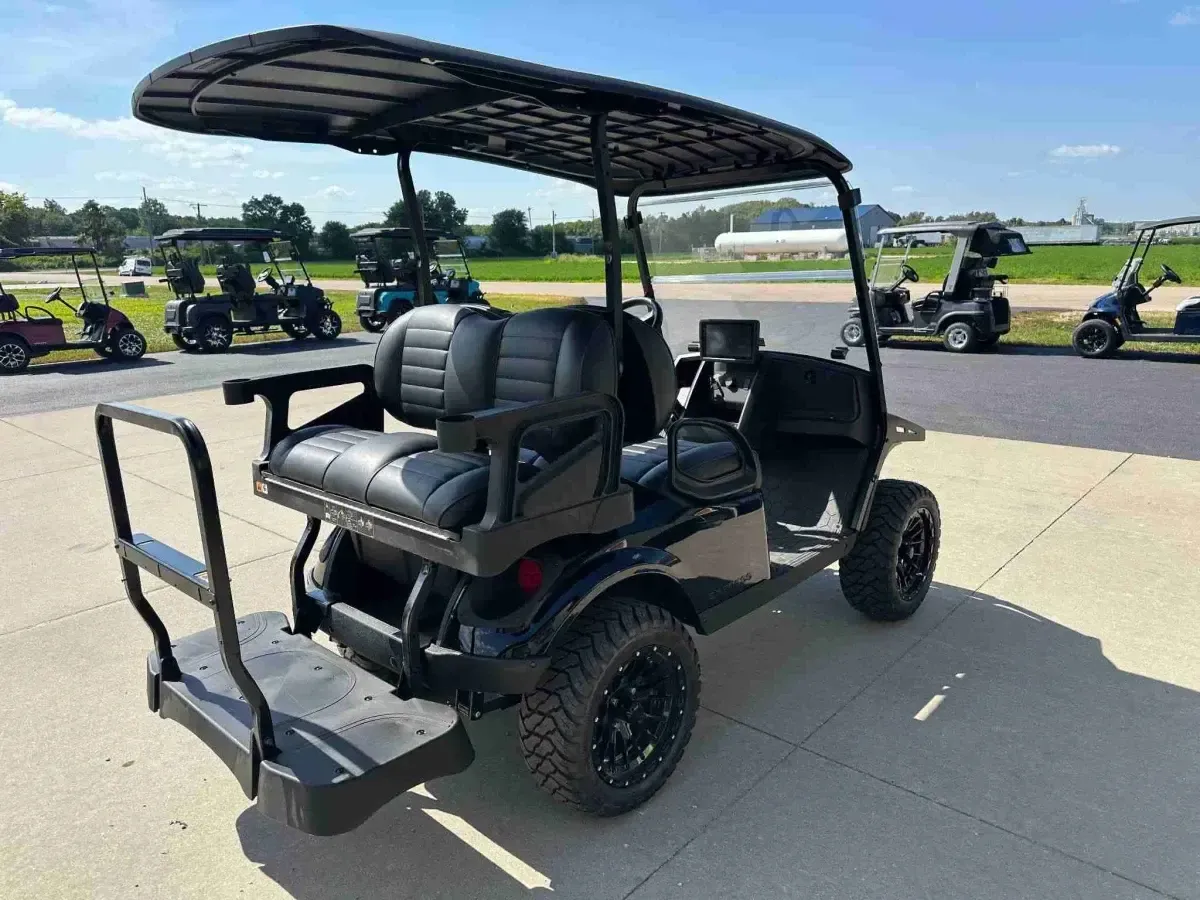 2027 E-Z-GO Express 4 Summit XT in Black, rear three-quarter view