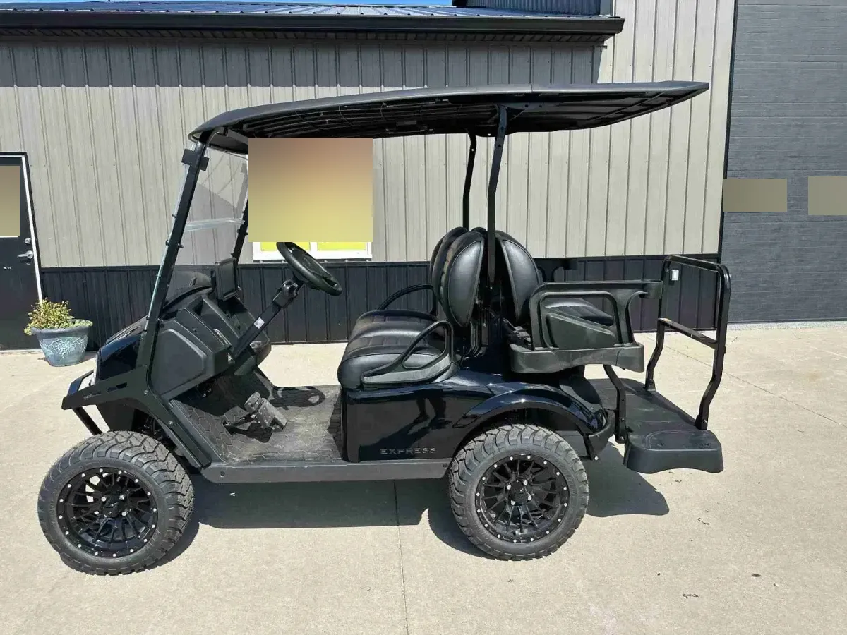2027 E-Z-GO Express 4 Summit XT in Black, side profile with black alloy wheels and rear flip seat
