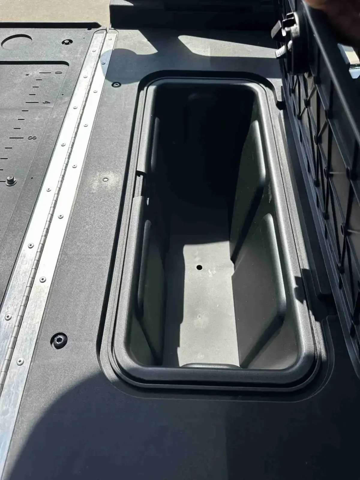Enclosed under-seat storage compartment on the 2027 E-Z-GO Express 4 Summit XT