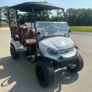 2027 E-Z-GO Liberty Summit XT ELiTE Lithium lifted four-seater golf cart in white, front three-quarter view