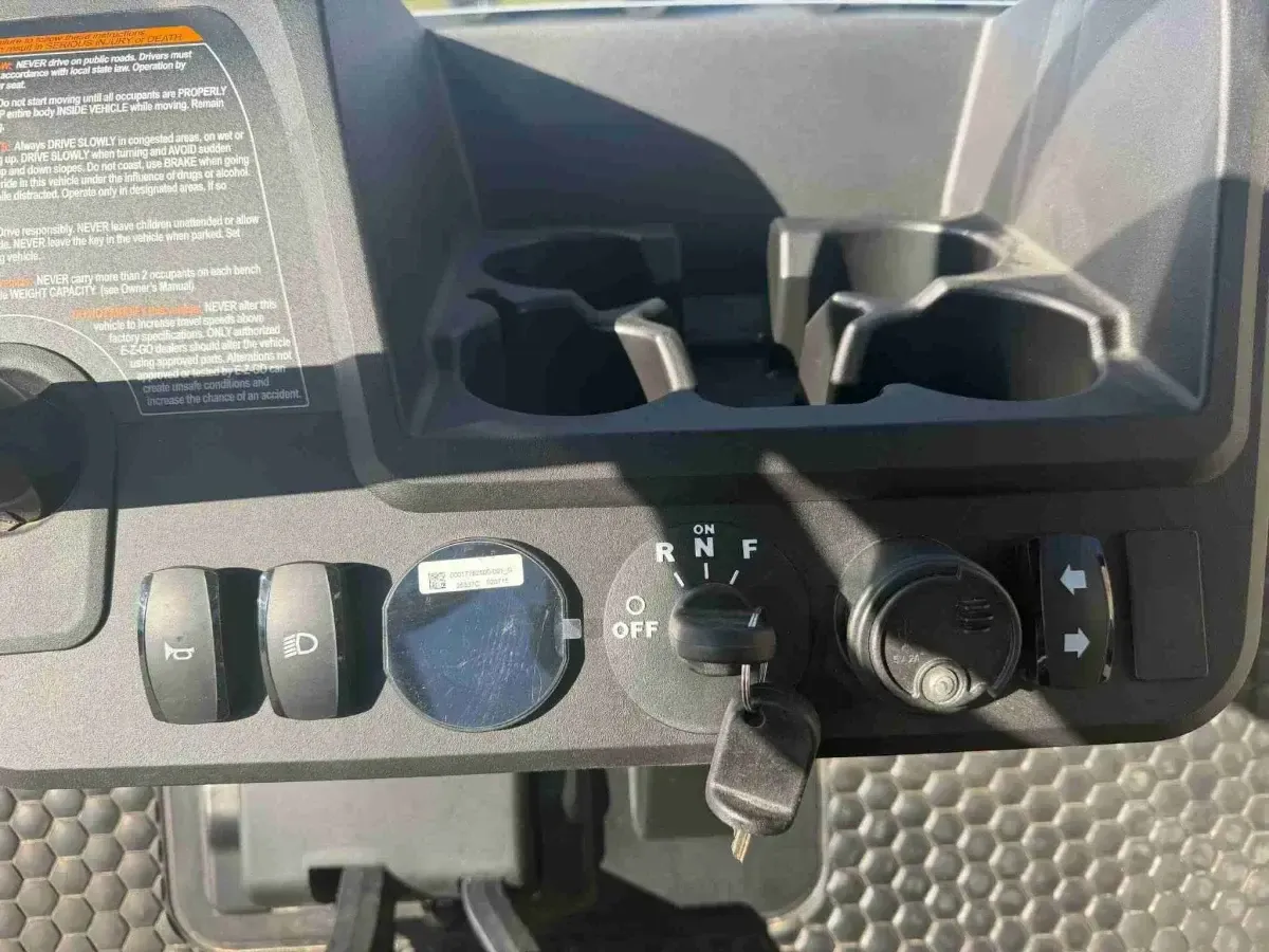 Dash controls with horn, lights, charge meter and turn signal switches on the 2027 E-Z-GO RXV Touring ELiTE Lithium