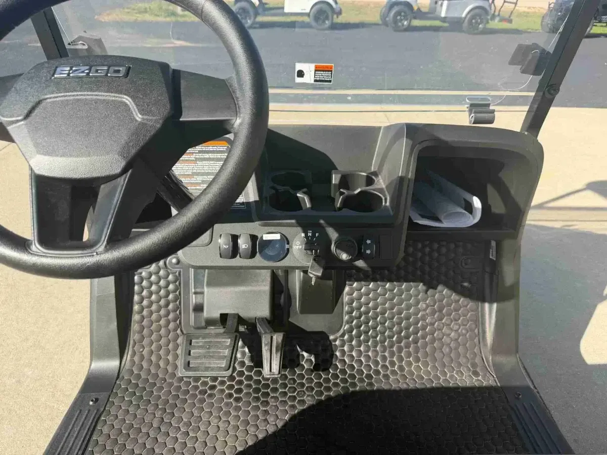 Dashboard with cup holders on the 2027 E-Z-GO RXV Touring ELiTE Lithium