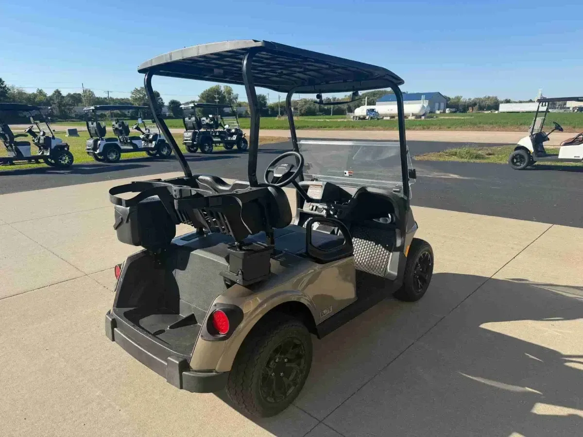 2027 E-Z-GO RXV Touring ELiTE Lithium in Bronze, rear three-quarter view