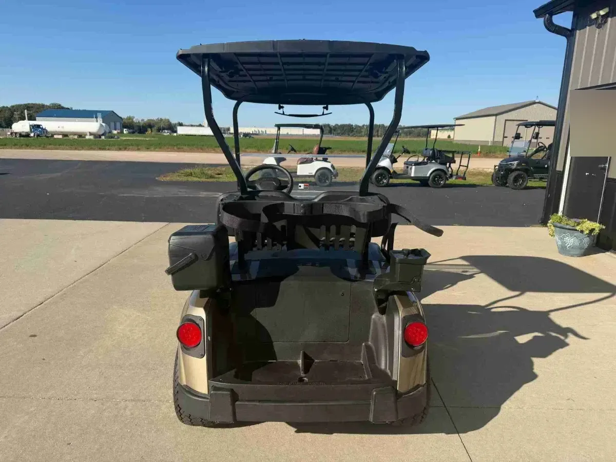 2027 E-Z-GO RXV Touring ELiTE Lithium in Bronze, rear view with bag well