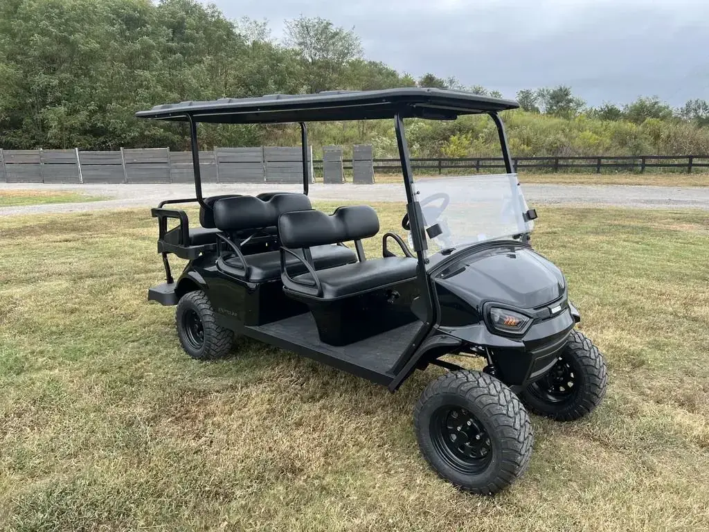 Front three-quarter view of the lifted E-Z-GO Express 6 Summit X from the right