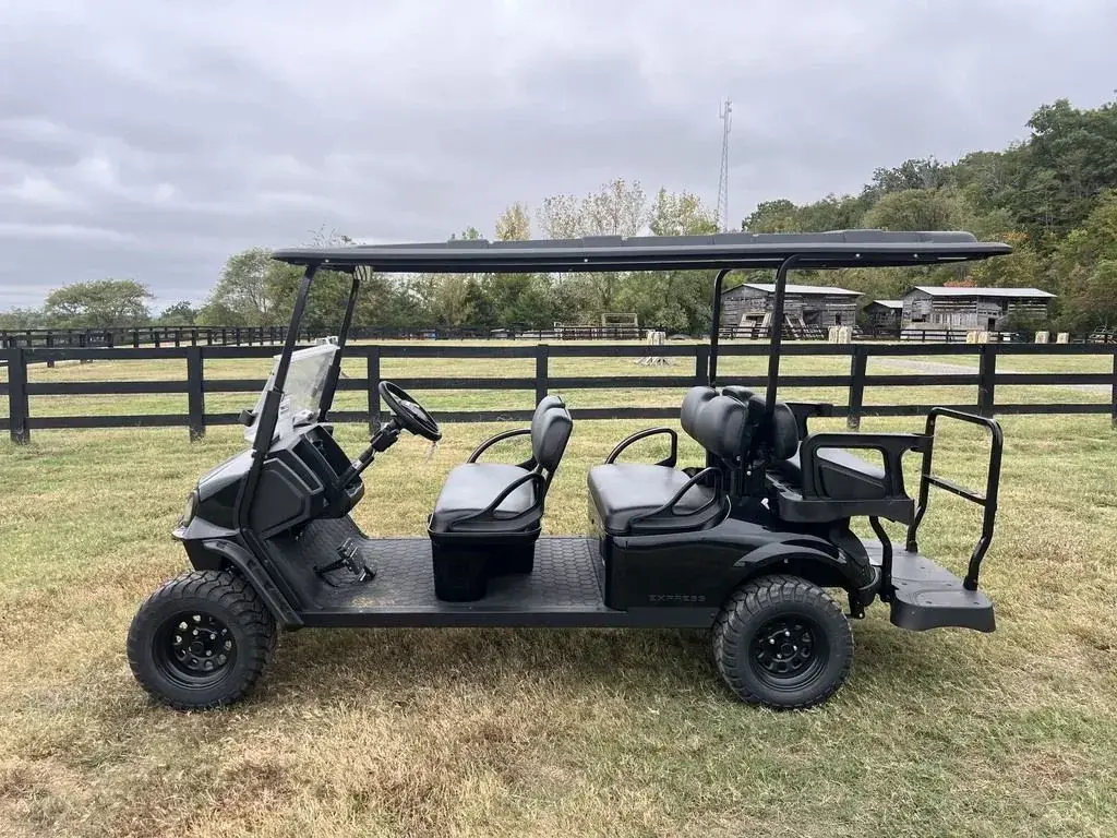 Side profile of the black E-Z-GO Express 6 Summit X six-seater