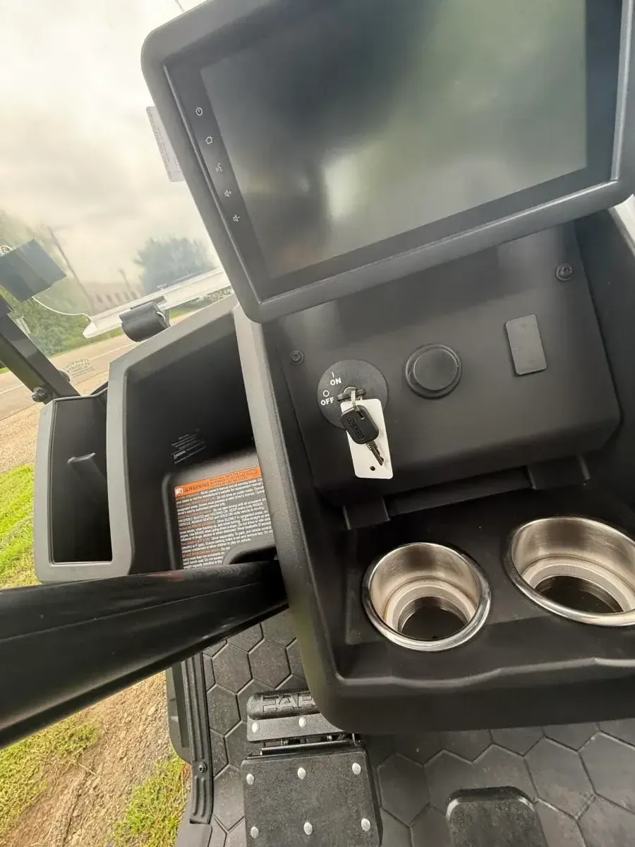 ECOXGEAR touchscreen and centre console with cup holders on the E-Z-GO Express 6 Summit XT