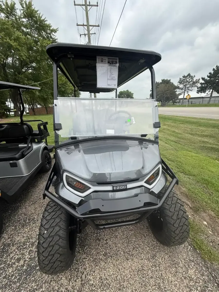 Front of the E-Z-GO Express 6 Summit XT with LED headlights, brush guard and off-road tyres