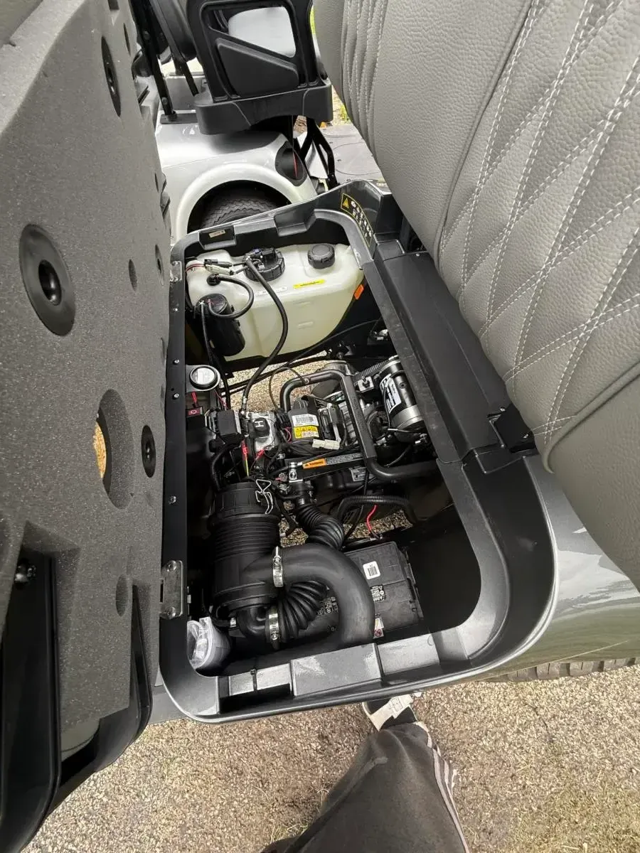 Petrol engine bay under the seat of the E-Z-GO Express 6 Summit XT