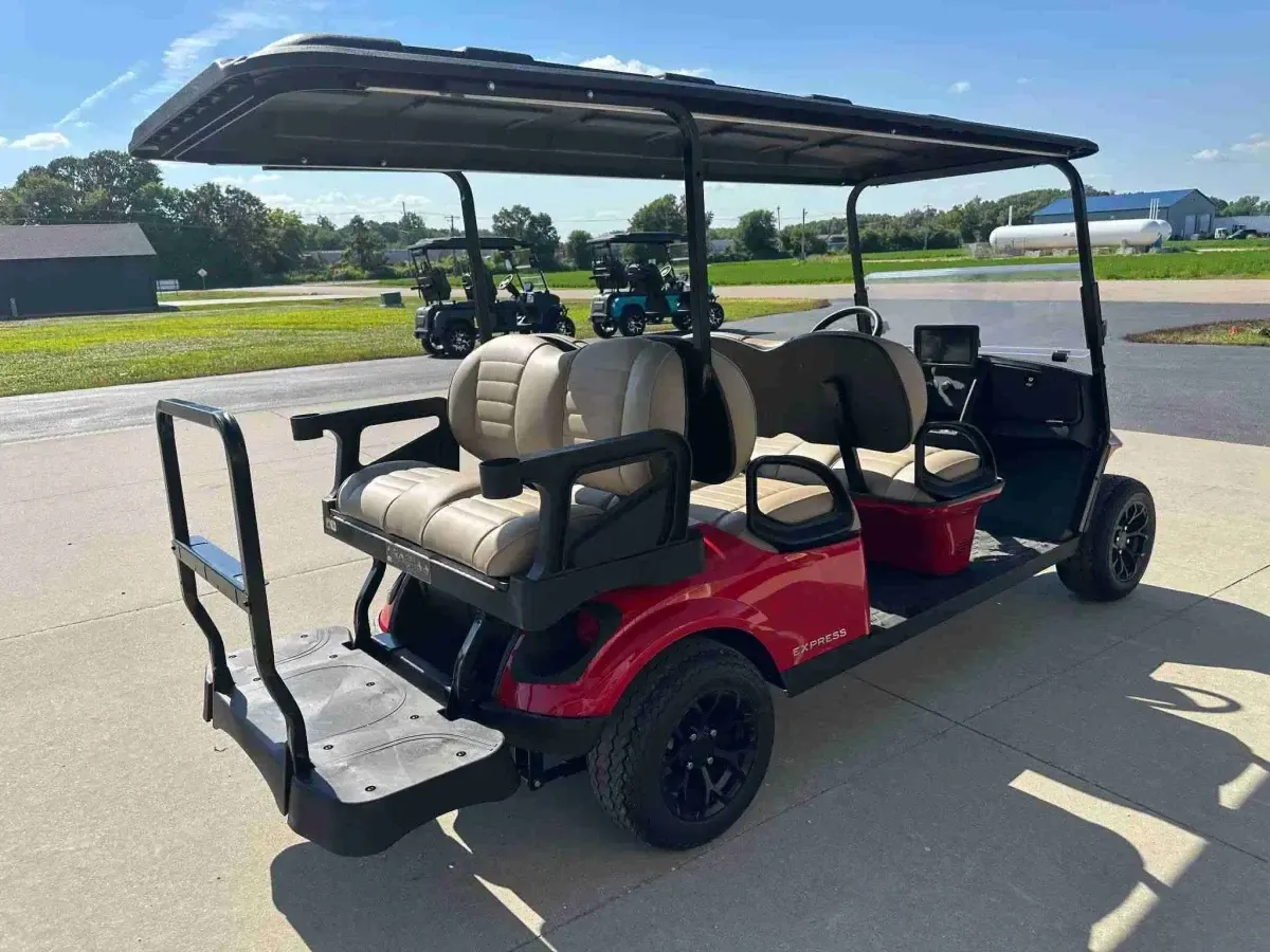 Rear three-quarter view of the E-Z-GO Express 6 Touring ST with rear-facing seat